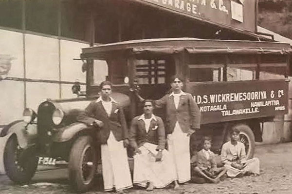 The registration number of the lorry appears to be F 1544 and serial number 23. I understand that there had been about 30 lorries. In the foreground, the drivers/cleaners are standing and the two boys seated maybe their children. I believe they started operations in the late 1890s, initially with bullock carts, transporting tea chests from the estate to the railway stations