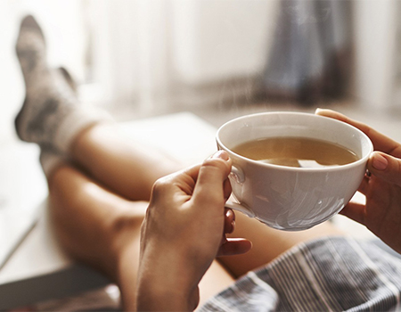 woman drinking tea relaxing
