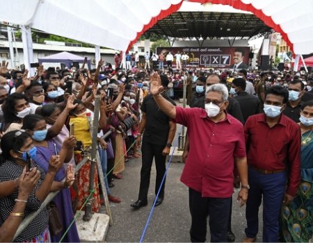 Sri Lankan President Gotabaya Rajapaksa (center) waves to supporters during a rally ahead of the upcoming parliamentary elections, near Sri Lanka’s capital, Colombo, on July 28, 2020.