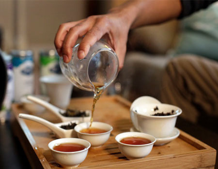 Rabin Joshi pouring an unusual Nepali oolong at his home in Saugus, Mass.CreditHadley Green for The New York Times