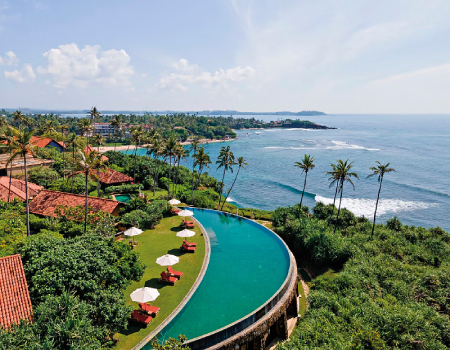 The expansive crescent-shaped infinity Moon Pool juxtaposes the spectacular coastal views.
