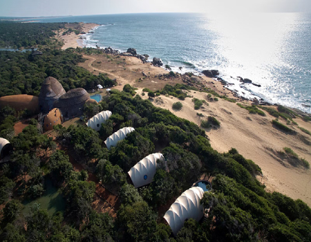 Perfectly positioned between the thick jungle and a pristine beach, the Wild Coast Tented Lodge in Yala seamlessly blends into its rugged surroundings.