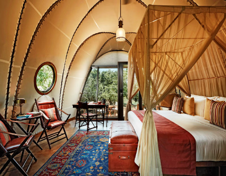 Cocoon suites come complete with panoramic jungle views, four-poster beds and rustic furnishings.