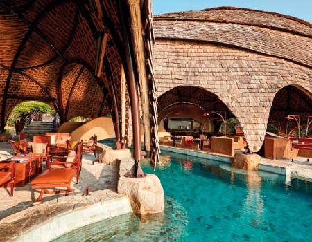 At the Wild Coast Tented Lodge, the dome-shaped Ten Tuskers bar and Dining pavilion mirror the boulders scattered across the golden beach beyond.