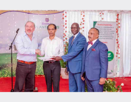 James Finlays Chairman Philippe de Gentile-Williams hands over the tea business to Browns Investments PLC Director Kamantha Amarasekera and Kipsigis Highlands Multipurpose Cooperative Society Vice-Chair Jonah Langat. Looking on is Sri Lanka High Commissioner in Kenya Dr. Kana V. Kananathan.
