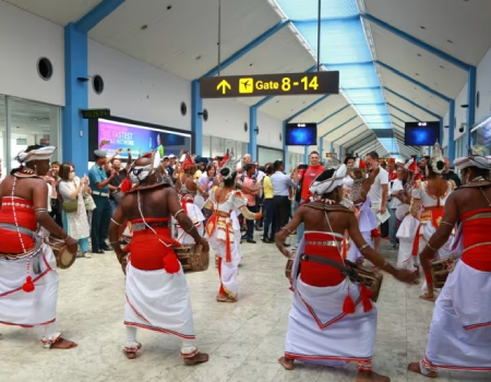 Dancers greet Russian tourists arriving at Bandaranaike International Airport, near Colombo, in July. A boost in visitors is expected from a recently announced free visa scheme for citizens of India, China, Russia, Japan, Thailand, Indonesia and Malaysia. (Courtesy of the Sri Lanka Tourism Promotion Bureau)