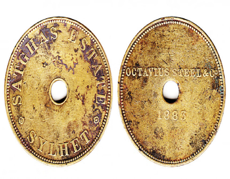 Tea-tokens, weighing 10.7 grams and with a diameter of 32 mm, were utilized in Srimangal Satgaon Tea Gardens. The obverse side of the coin features the inscription SATGHAS ESTATE SYLHET in a circle, while the reverse side bears the engraving OCTAVIUS STEEL & CO. 1883 below it. This image was sourced from coin collector and expert Noman Nasir.